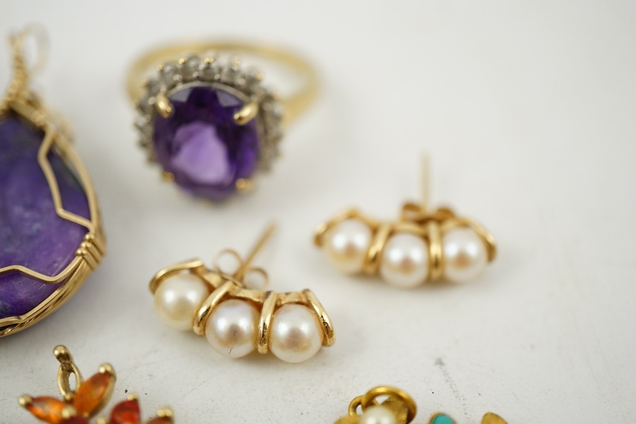 A collection of jewels, comprising: two amethyst and diamond rings; a cultured pearl and circular-cut sapphire wreath brooch; a fire opal pendant, one stone deficient; and a pair of cultured pearl earrings, all mounted i